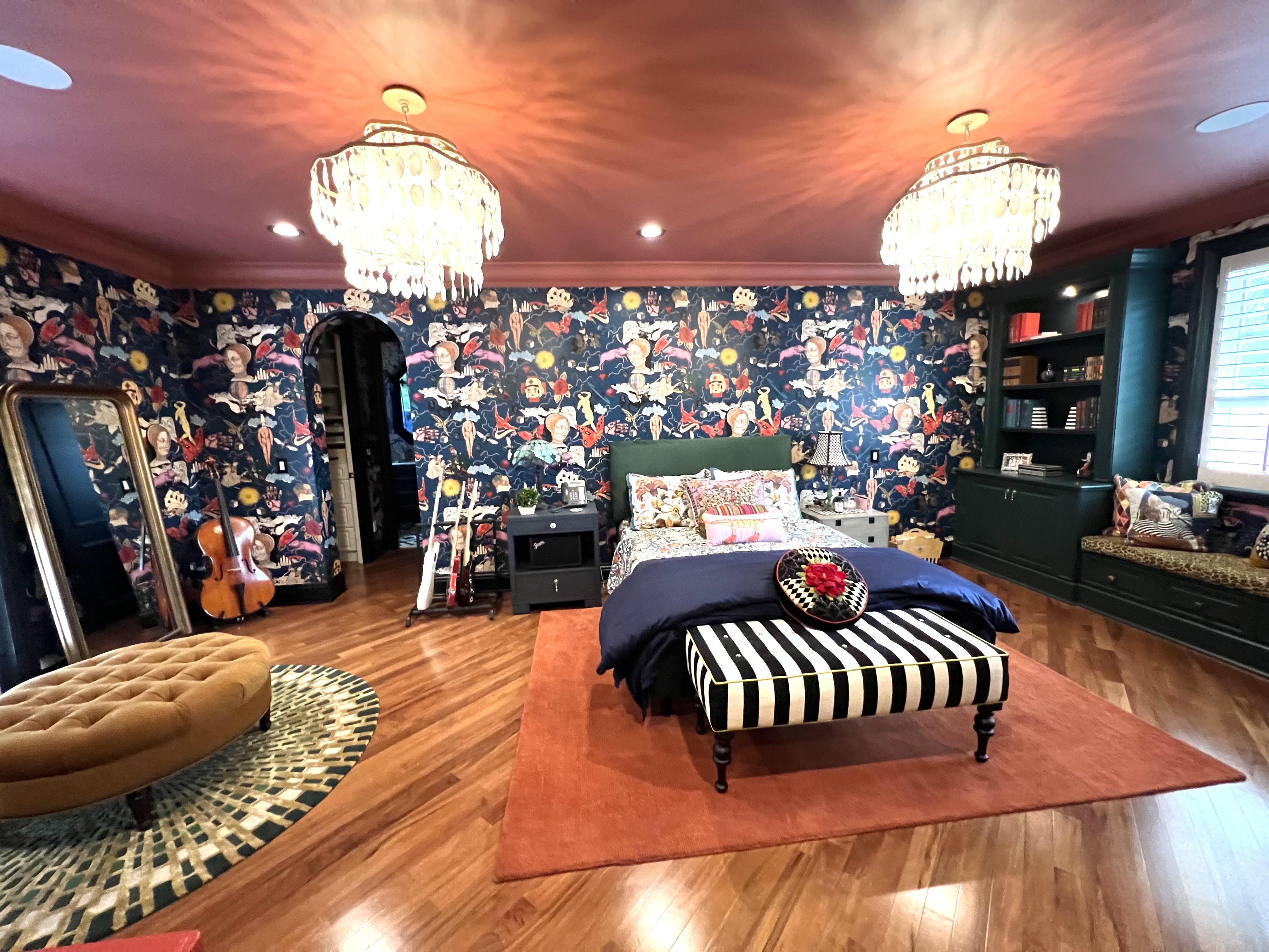 Maximalist daughter’s bedroom with bold wallcovering, coral ceiling, and layered furnishings