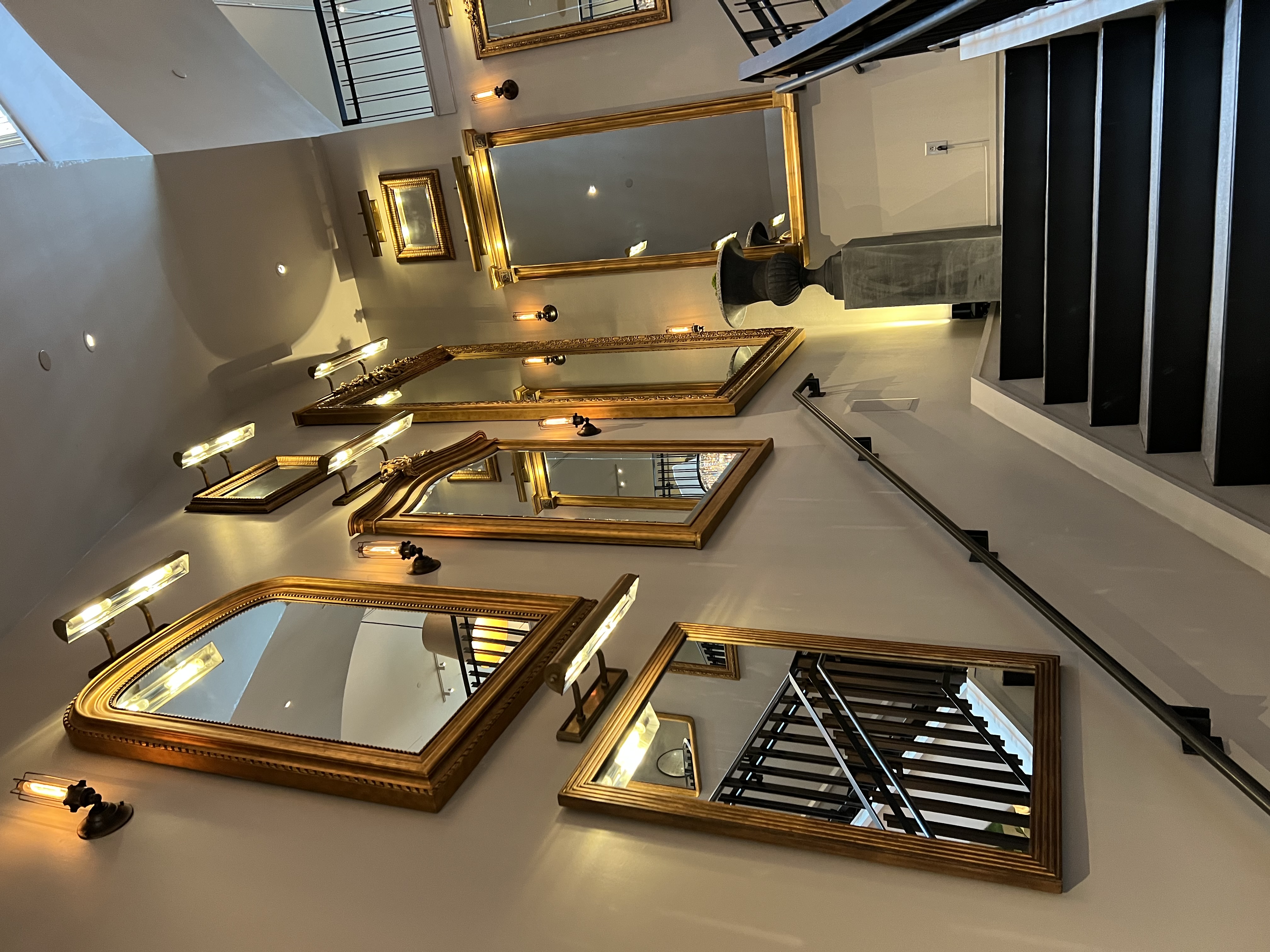 Mirror-lined stair hall leading to the daughter’s maximalist suite