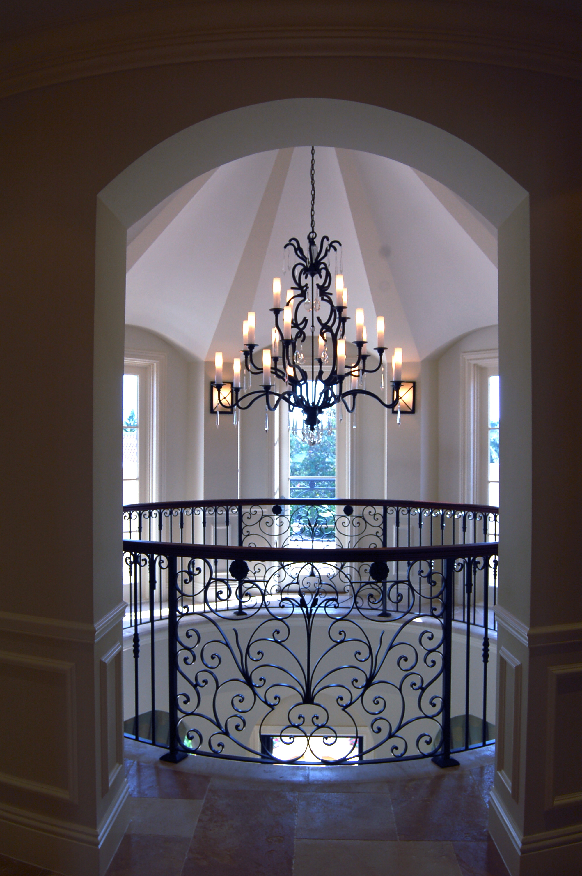 View through arched opening to rotunda stair hall