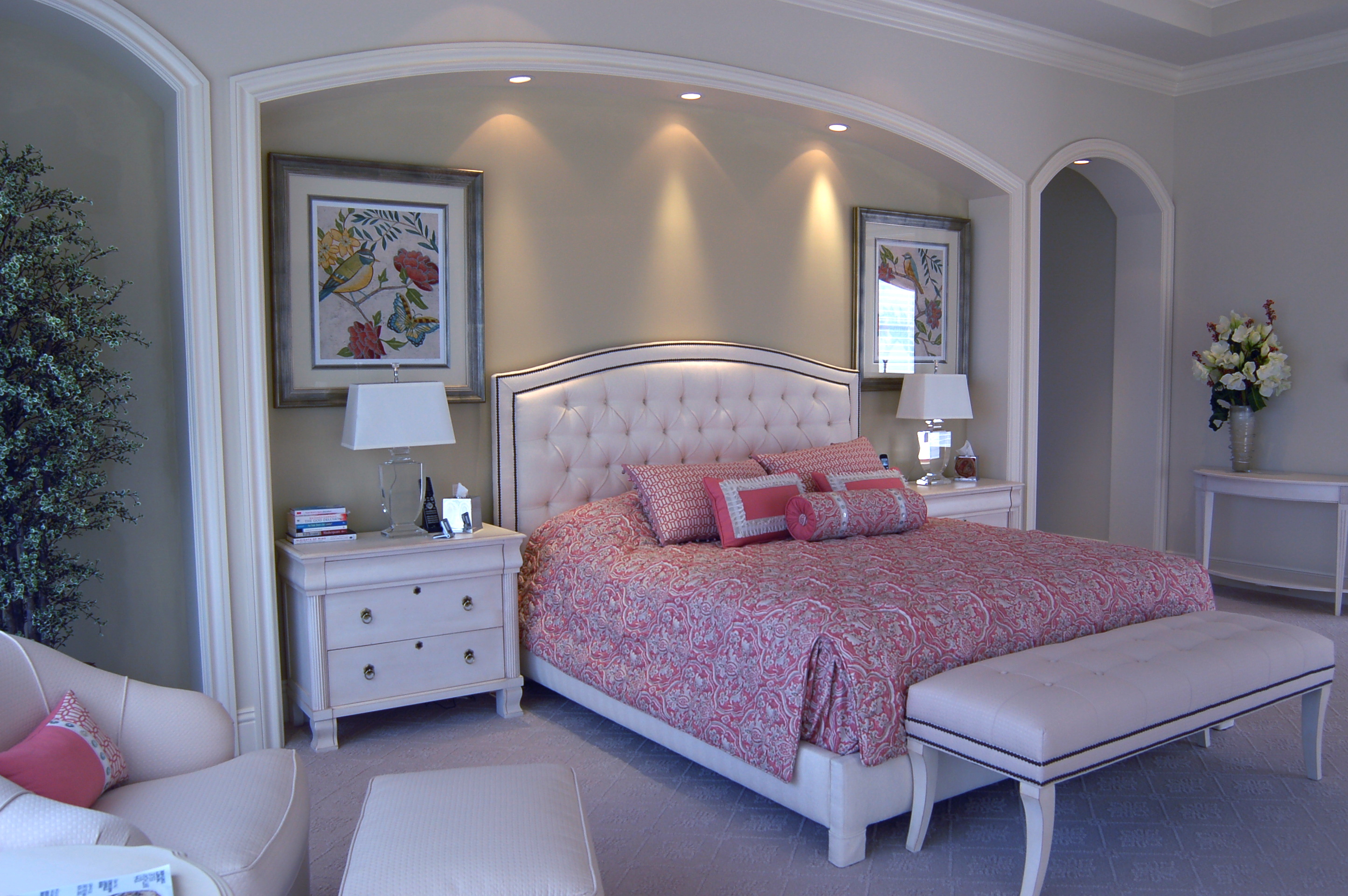 Primary bedroom with upholstered bed and soft transitional furnishings